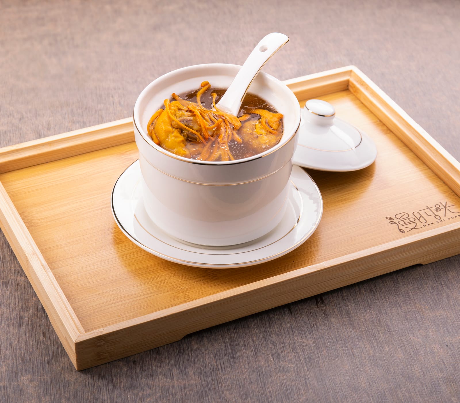 Cordyceps flower and pigeon herbal soup in an individual ceramic pot