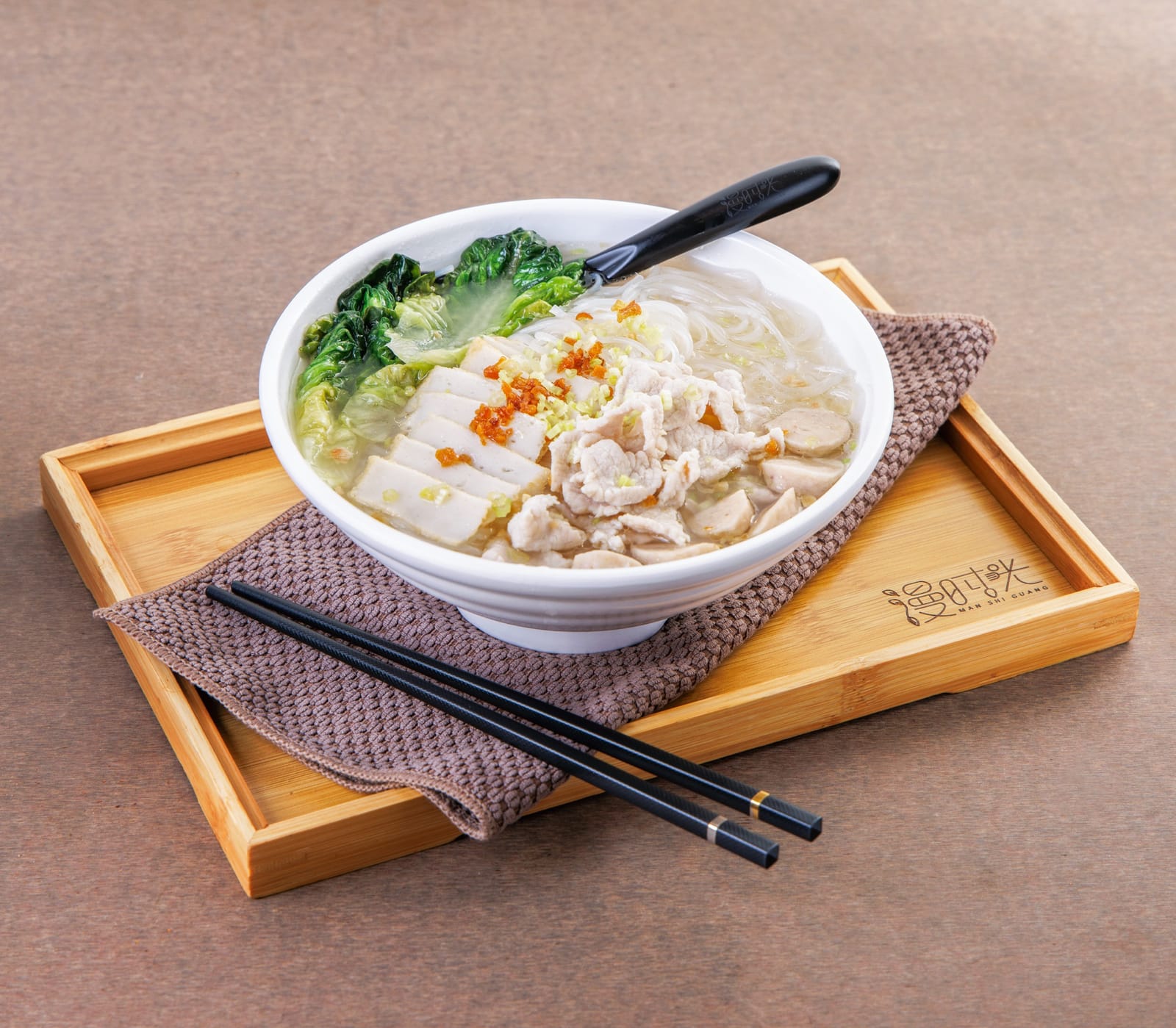 Signature original soup noodles topped with lean pork, fish cake and meatballs